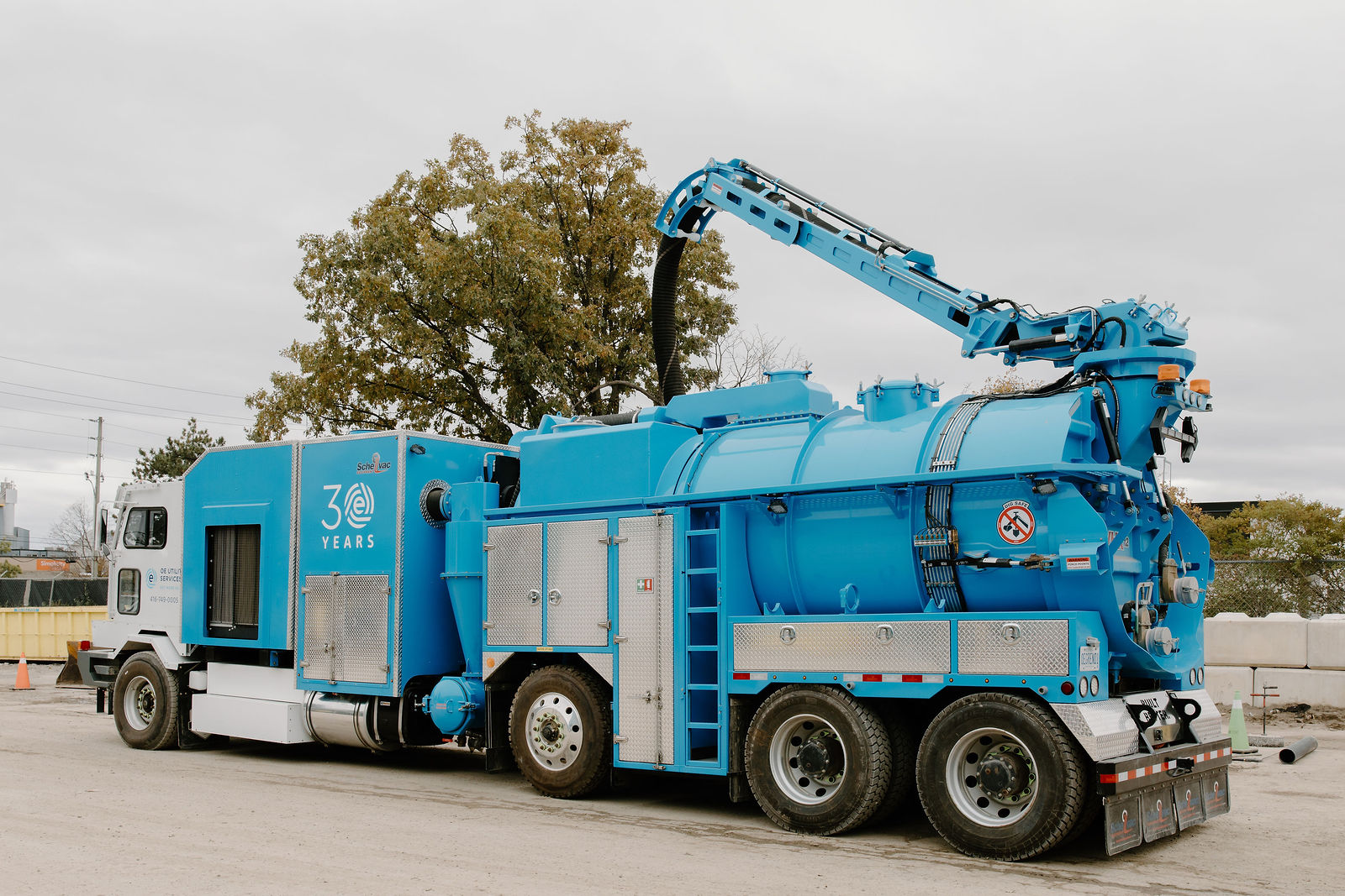 The hybrid hydrovac truck from the rear with its boom raised